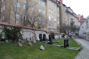 Commemorative graves and old tombstones recovered around the city. The apartments overlooking the site were built just outside the cemetery walls in the early 20th century.