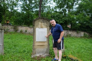 Jacek reading a tombstone in the new Jewish cemetery, Dukla