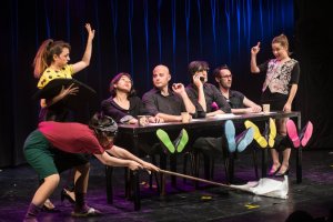 Omri is the one looking left near the middle of the photo.